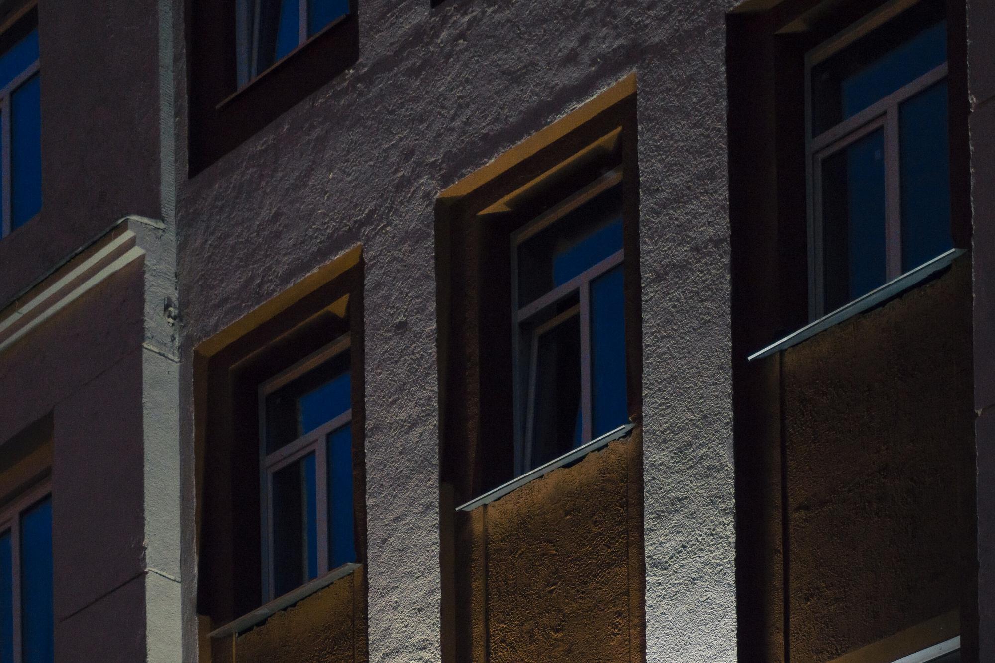 Facade of restored historic building at dusk